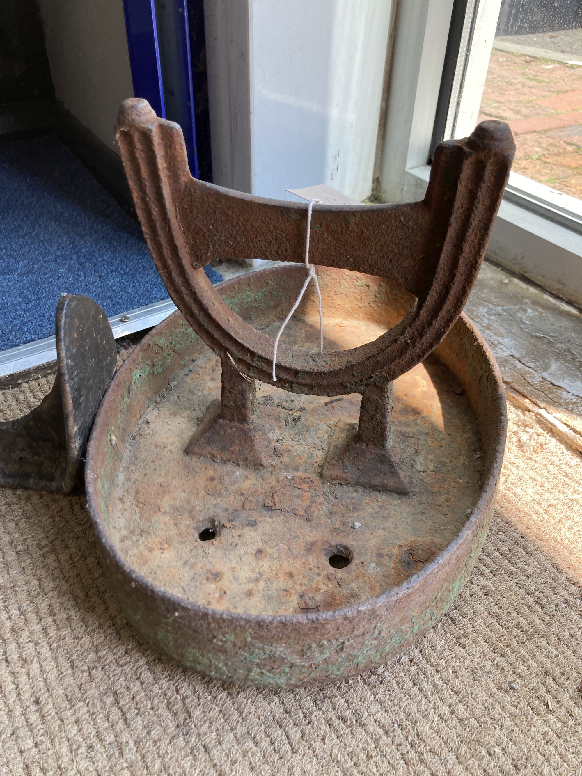 A Victorian cast iron boot scraper, width 33cm, height 26cm together with a cast iron Cobbler's last